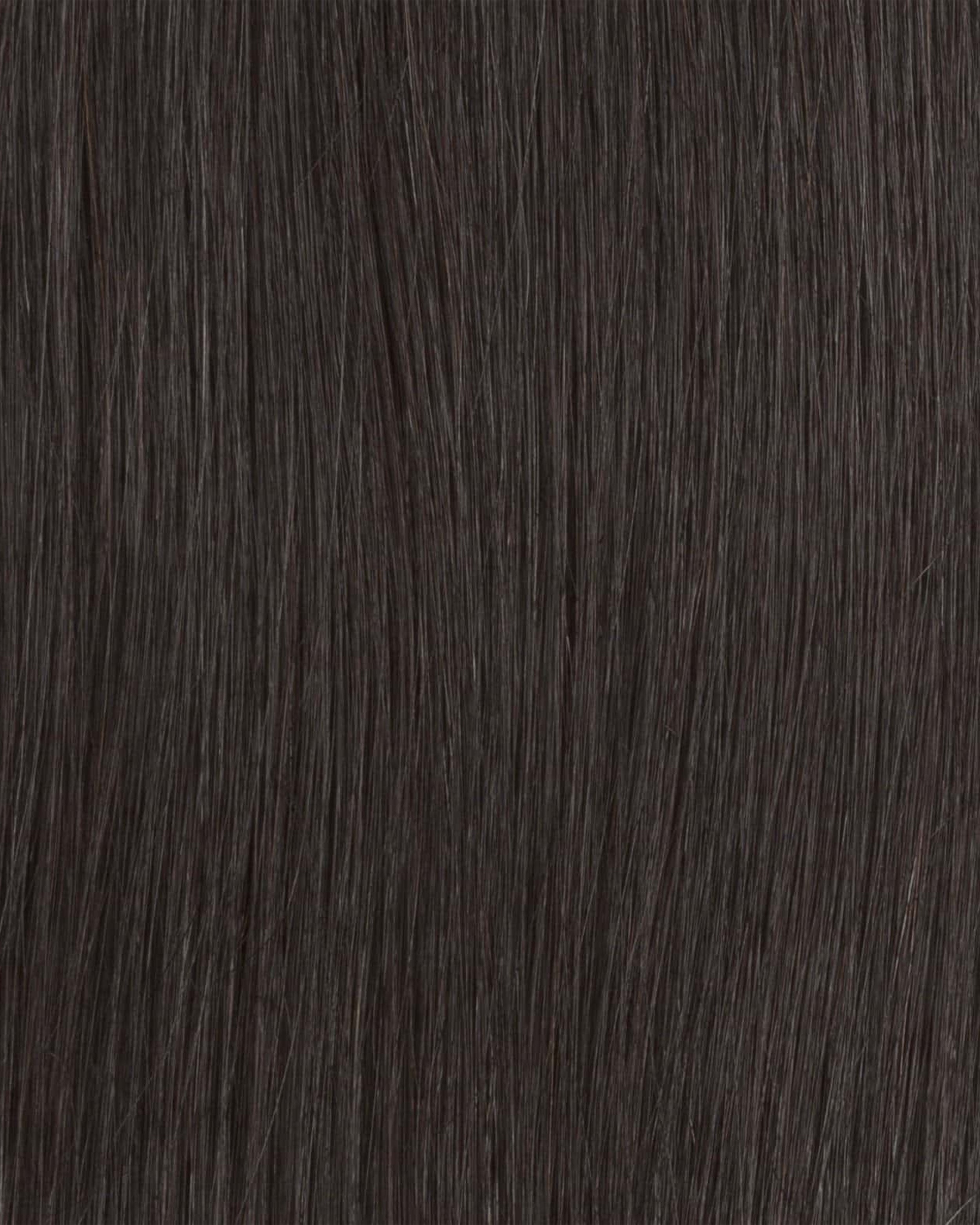 Close-up of dark brown hair texture